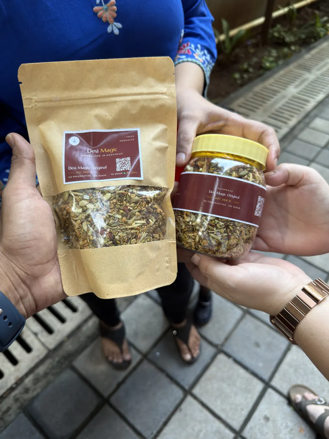 A jar and a pouch of Desi Magic held together