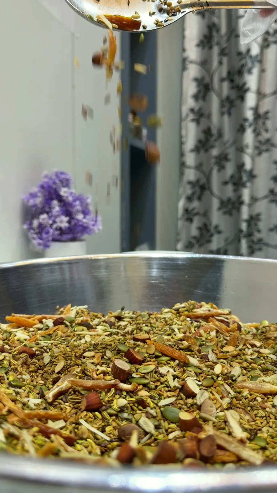 A wide steel paraat full of freshly blended mukhwaas